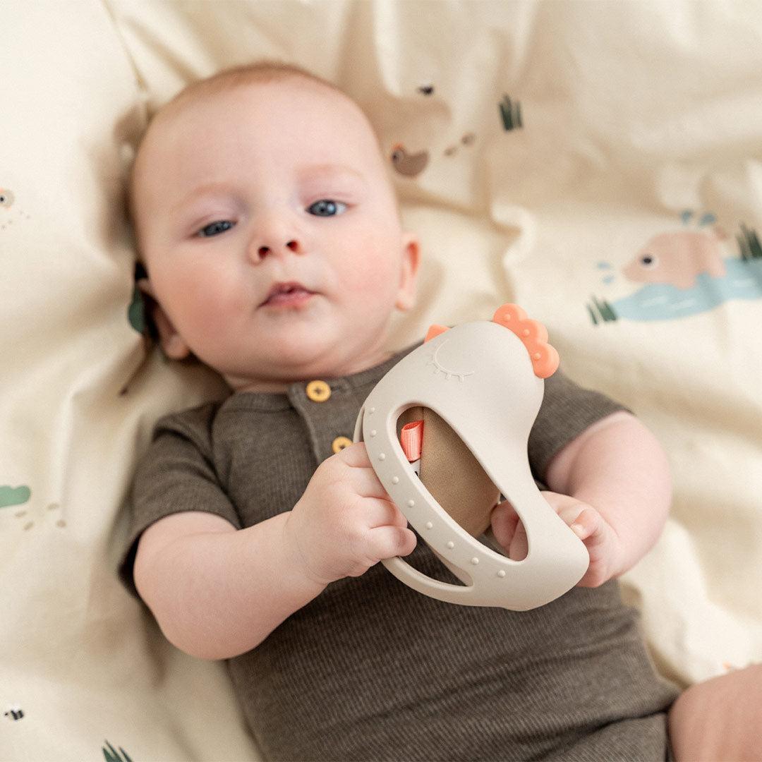 Done by Deer Grip and Teether Toy with Rattle Clucky - Beige